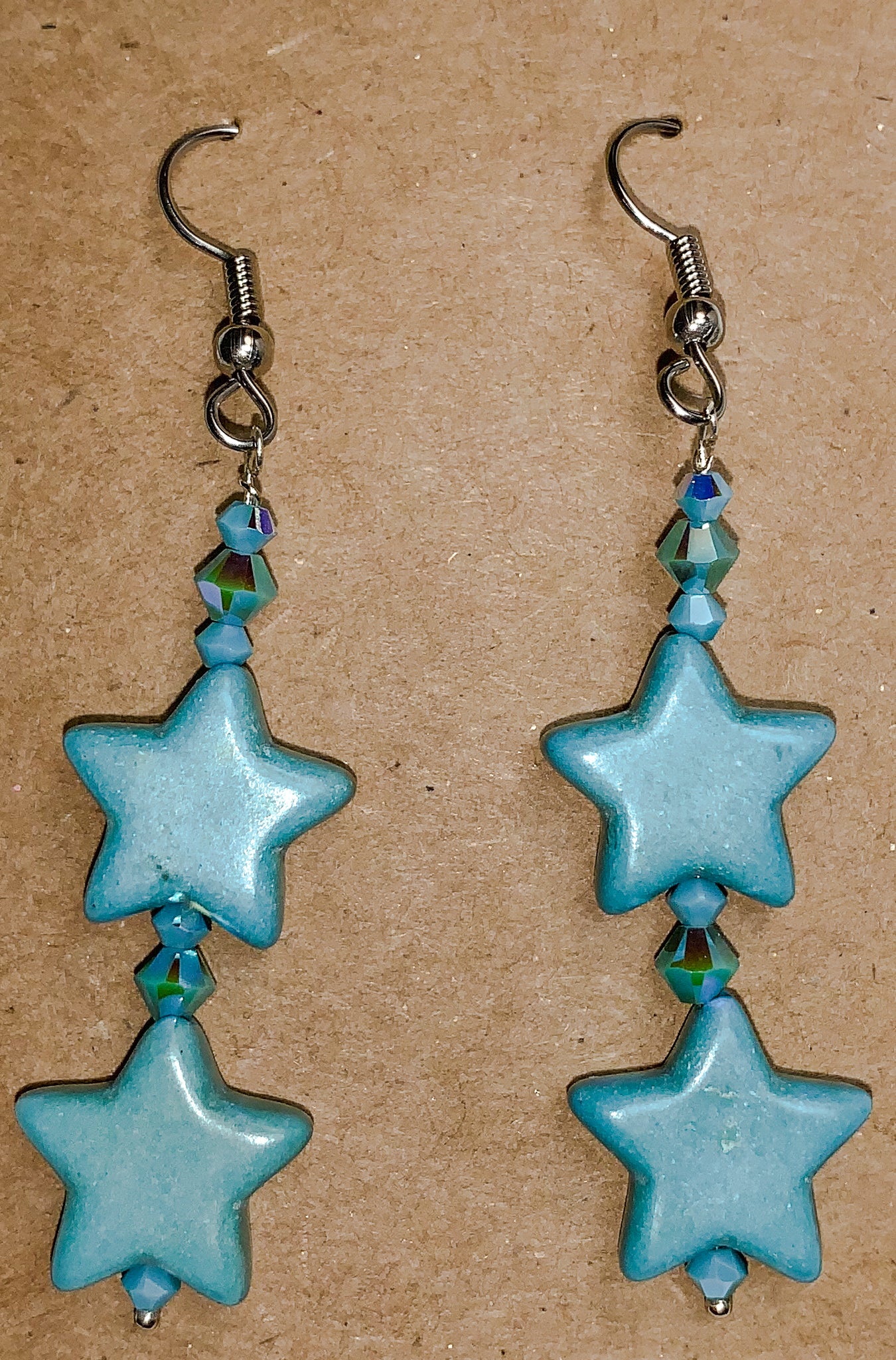 Turquoise colored star charms and crystal earrings
