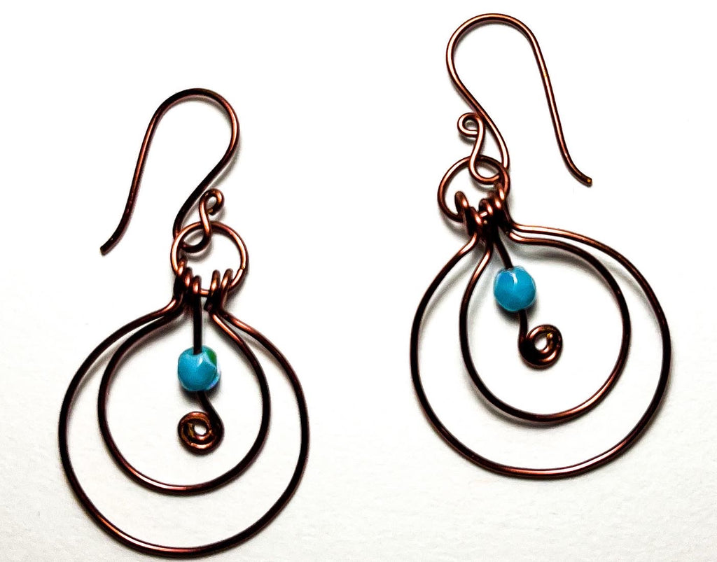 Antiqued copper wire wrapped hoops with teal bead accent earrings